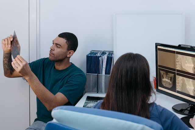 a man looking at an x ray image