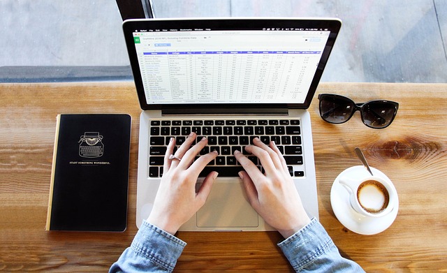 notebook typing coffee computer