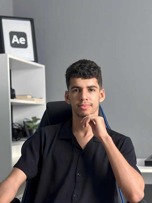 young man in modern workspace with tech decor